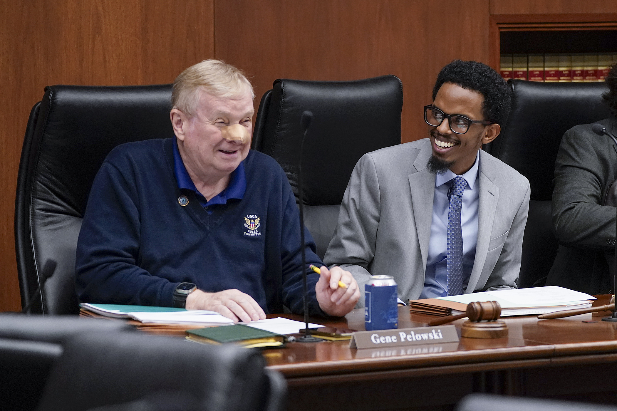 Rep. Gene Pelowski, Jr. and Sen. Omar Fateh share a laugh before convening the conference committee on the higher education finance and policy bill May 16. (Photo by Michele Jokinen) 